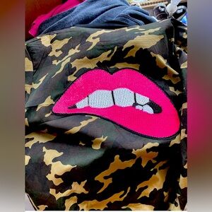 Camo jacket with a fun lip smile on back